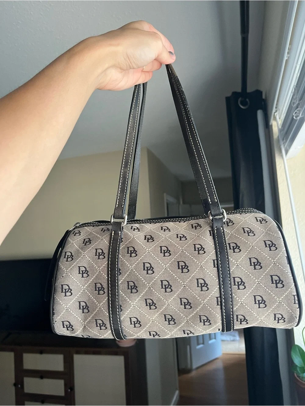 Dooney & Bourke Beige and Black Monogram Barrel Bag with Charm